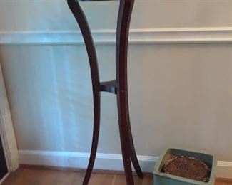 Tri leg plant stand with brass gallery surrounding top
