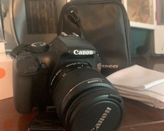 Canon Camera comes with backpack case, extra lenses and other accessories