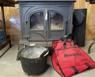 Vermont Castings wood stove with pipes