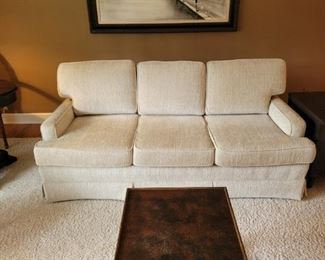 $200, Excellent condition cream couch. $25 Small cane table with casters, SOLD- BARNET oil painting