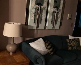 . . . a nice ceramic lamp, more abstract art and a nice sofa in green tone