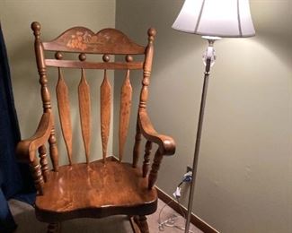 . . . a nice solid wood rocker -- might be Hitchcock?  Notice nice brushed nickel lamp
