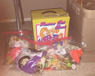 Several vintage barbies, store and handmade clothes and various shoes. 