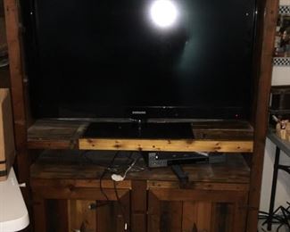 Heavy custom made wooden entertainment. 

Nice tv (no remote) 