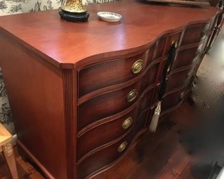 Vintage Kindel Furniture mahogany dresser with curved front and 12 drawers. 59"W x 22"D x 35"H.