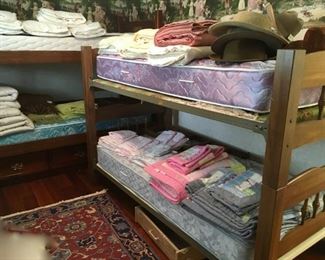 2 sets of bunk beds. left: drawers under bottom bunk. right: bought by original owner 1965.