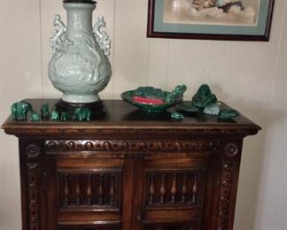 Heavily carved solid wood cabinet - use as buffet, liquor cabinet or TV stand.  40.75"W x 18.25"D x 37.75"H.  Vintage Wildwood porcelain Asian dragon lamp. Malachite animal figurines.