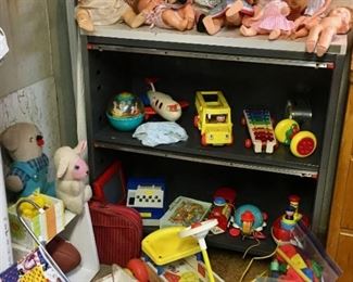 Vintage Tonka, Matchbox cars, action figures, Playmobil figures, including 1974 Geobra. Playmobile cowboy toys. Army figures, vehicles. Several Fisher Price toys including Pull-A-Tune, airplane, school bus, radio, pocket camera, parking garage, figures, vehicles, Roly Poly. Legos. 1960s-1970s toys.
