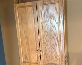 Dart board in wall cabinet 