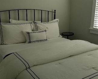 Queen box spring & mattress available (owner keeping black metal bed); beautiful bedding!