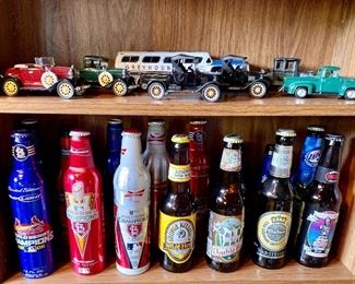 Diecast cars, collectible beer bottles. (All beer cans and bottles are empty)