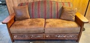 Sofa by Old Hickory. This outstanding sofa by Old Hickory measures 84x34x36 inches. It has suede pillows and wood inlay on the front and side panels. Sold in very good condition with light wear. 