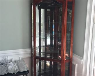 #38	Howard Miller corner display cabinet with 4 glass shelves, etch glass doors 24x32x84	 $1,000.00 	
