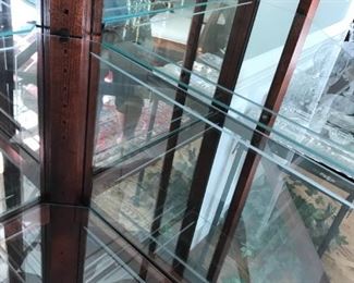 #38	Howard Miller corner display cabinet with 4 glass shelves, etch glass doors 24x32x84	 $1,000.00 	

