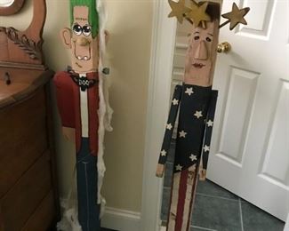 #129	(2)  4 foot wood statues of frankinstin and red white blue person with star on head  $30 ea 	 $60.00 	
