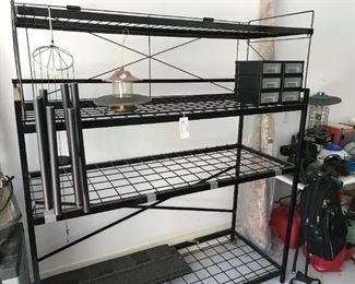 #165	Heavy black metal shelf with 4 shelves 67x26x77 top can come off 	 $200.00 	
