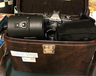 #232	Minolta xD11 camera with lids in bag 	 $60.00 	

