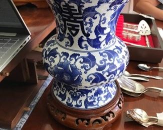 #237	blue white vase on wood base 10x9	 $30.00 	
