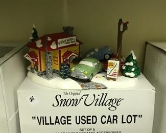 #256	snow village Village used car lot by dept 56	 $25.00 	
