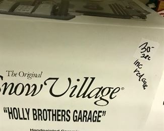 #257	snow village Holly brother garage 	 $30.00 	
