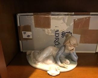 #32	Llodra 5609 statue of girl laying on elbow with geese on her side 	 $40.00 	 x 
