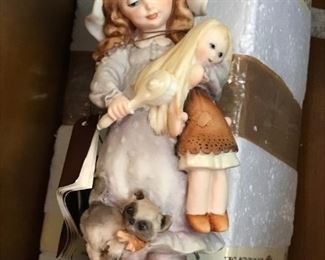 #29	Di G. Armani statue of girl with doll with cat	 $25.00 	

