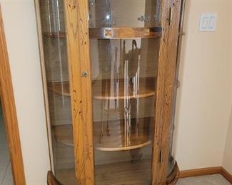 Vintage half-round curio cabinet