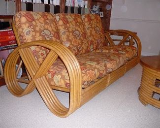 1940's 5-STRAND "PRETZEL" RATTAN SET - in the style of Frankl, made in the Philippines, consists of a 3-piece sofa, round coffee table, 2 club chairs, 2 ottomans, 2 demi-lune end tables, cushions with original fabric plus an additional set of custom slip covers
