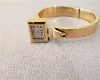 14k yellow gold wristwatch with contemporary gold band and no maker’s
name on face of watch, 59.1 grams of gold weight 
