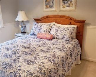 Pine wood queen size headboard and a set of blue and white bedding priced separately 