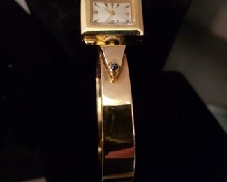 14k yellow gold wristwatch with contemporary gold band and no maker’s
name on face of watch, 59.1 grams of gold weight 

