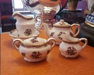 Coalport porcelain “Ming Rose” miniature tea set including: teapot, creamer, sugar, pitcher and washbowl, together with a small dish, 6 pieces
