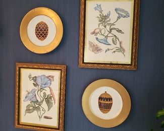 Pair of floral prints with snails and butterflies and two Faberge gold rim egg plates
