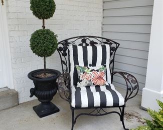 Wrought iron chair, one of two and a faux topiary in a pot also one of two
