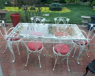 Large glass top patio table and six chairs