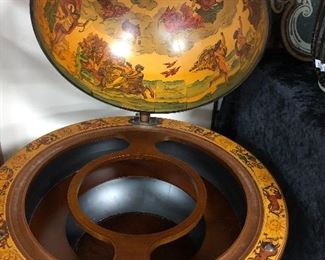 Classic old world globe drink cabinet. Swivel casters, bottle and glassware storage inside.