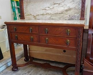 Marble-topped buffet with hand-cut details