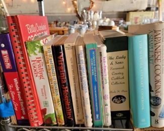 Various soft and hard cover cookbooks