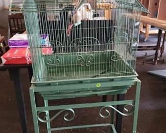 Vintage metal birdcage on stand