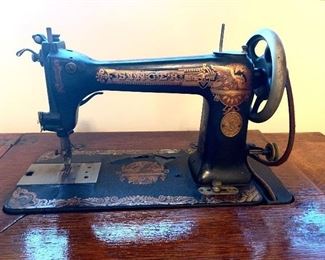 Vtg. pedal Singer sewing machine w/cabinet