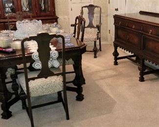 Jacobean-style antique dining room table and chairs by Rockford Superior Furniture Co.