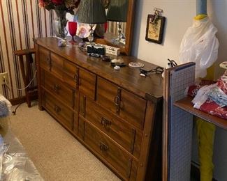 Dresser with brass accents and mirror.  Has matching pieces.
