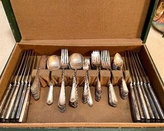 2 sets of flatware!Aand cabinets full of crystal and china