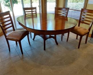 Dinette set  - 74 " with leaf - 54" round without leaf - four chairs