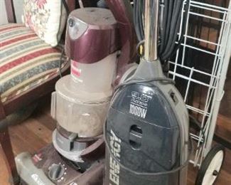 Several vacuums, cleaning supplies, scissors and so on