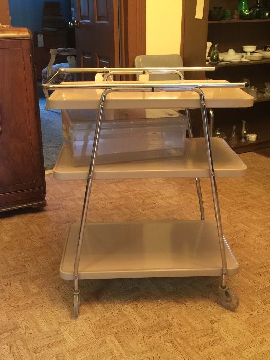 Mid-Century Modern style shows in this handy utility or bar cart. 