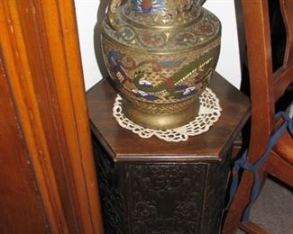 large brass urn on a little table