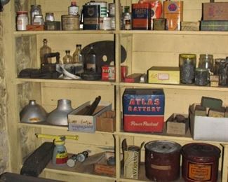 misc. old tins, boxes and other items. Notice the old atlas battery box