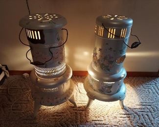 2 Antg. Oil Heaters, Have Been Lighted