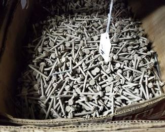 Special nails with rubber washers used for putting tin siding on barns